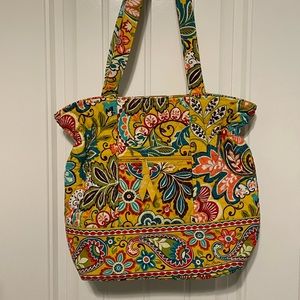 Vera Bradley purse with ruffle detail on top.